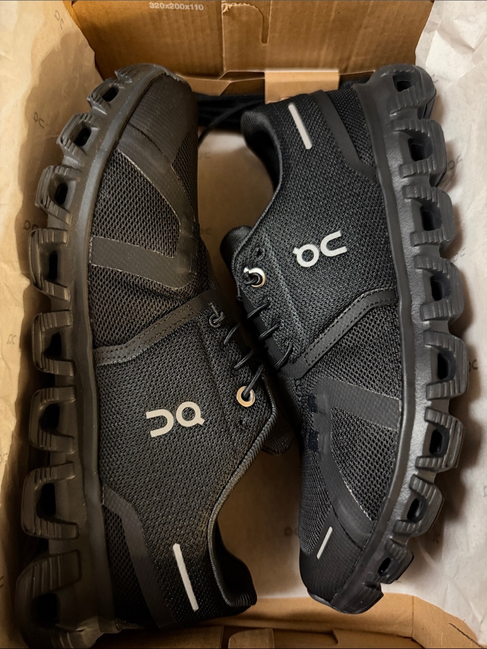 On Running Women Athletic Shoes in Black with Reflective Accents